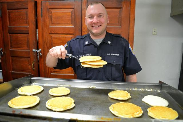 Rich Schroeter making pancakes on the griddle.  